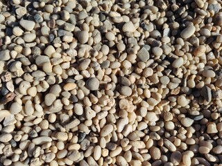 River, sea pebbles, small fraction. Stones for path. Gravel. Pebbles in landscape design. Round stones close up