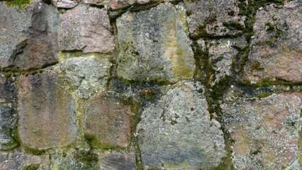 Textured Stone Wall With Moss and Lichen in a Historic Location