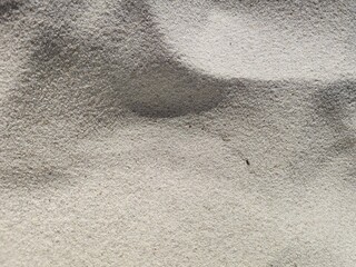 sand texture close up. White, yellow, beige sand close up. Beach sand - textured, with different lighting. River, sea, reef sand
