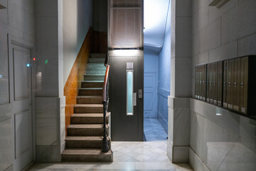 Interior view of residential building stairwell and elevator in Barcelona