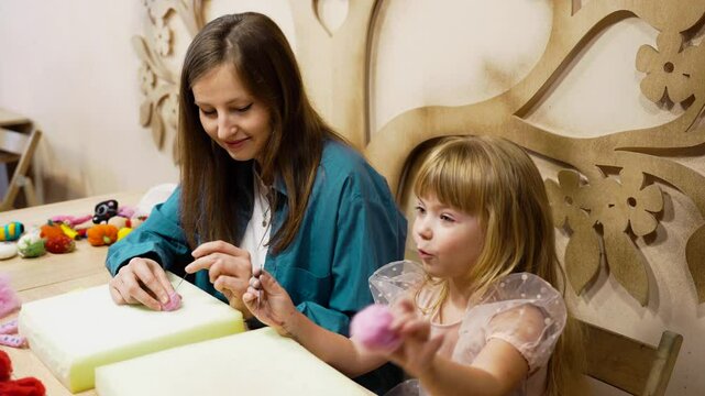 Crafting fun with kids at a hands-on workshop in a cozy art studio