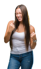 Fototapeta premium Young caucasian beautiful woman over isolated background very happy and excited doing winner gesture with arms raised, smiling and screaming for success. Celebration concept.