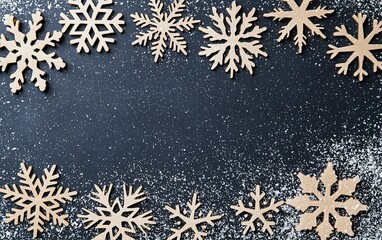 Decorative wooden snowflakes arranged on a dark surface surrounded by light snowflakes during the winter season