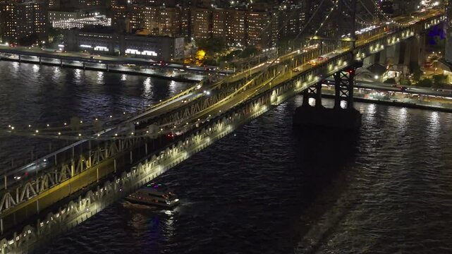 Aerial view of the subway crossing the Manhattan Bridge at night