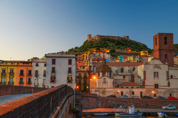 The town of Bosa and the old castle built by the Marquis of Malaspina in 1112 at sunset, Oristano,...