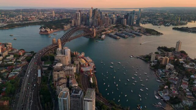 Aerial drone view of Sydney City, the Sydney Harbour and Harbour Bridge looking toward Lavender Bay, NSW Australia on a sunny late afternoon in September 2024
