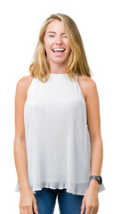Beautiful young elegant woman over isolated background winking looking at the camera with sexy...