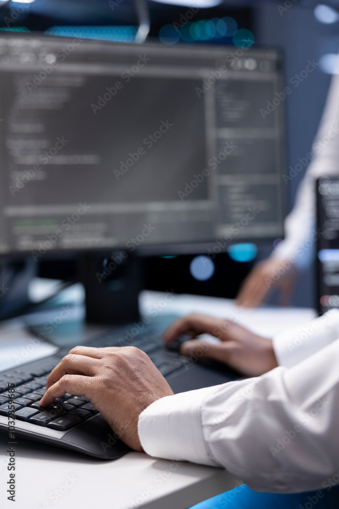 Poster admin in data center checking equipment performance on computer after upgrading infrastructure. clos