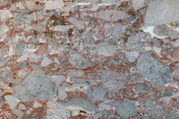 Rough texture of natural stone, red granite rock