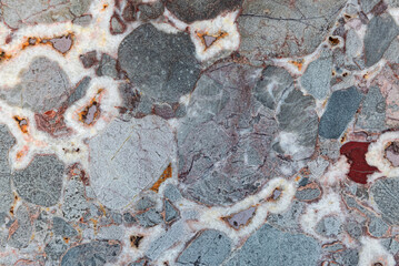 Rough texture of natural stone, red granite rock © Maryna Konoplytska