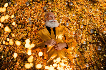 Top view photo of vogue style trend grandfather lying christmas balls decor wearing glossy festive...