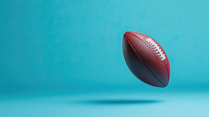 American football ball isolated on blue background. 3D render,clipping path, full depth of field