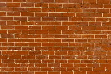 Obraz premium Red brick background that has pattern full copy space. Full frame Red brick background that has grey paint repair pattern for full copy space