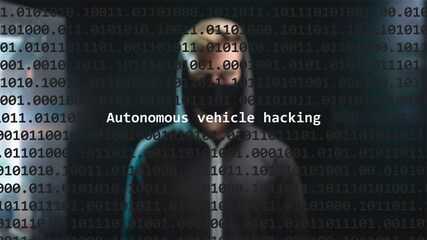 Cyber attack autonomous vehicle hacking text in foreground screen, anonymous hacker hidden with hoodie in the blurred background. Vulnerability text in binary system code on editor program.
