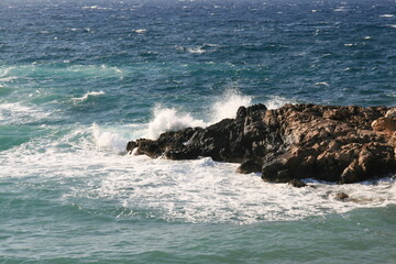 Waves crashing on rocks