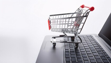mini trolley with laptop, online shopping concept in global supermarket.