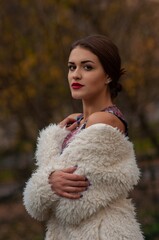 Close up trendy portrait of elegant young woman with big eyes and red lips