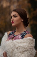Close up trendy portrait of elegant young woman with big eyes and red lips