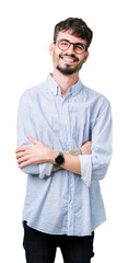 Young handsome man wearing glasses over isolated background happy face smiling with crossed arms looking at the camera. Positive person.