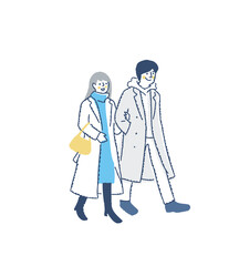 並んで歩いている冬服の若いカップル