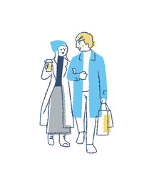 並んで歩いている冬服の若いカップル