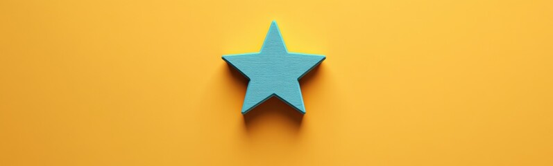 Obraz premium Blue star shaped object on a yellow surface
