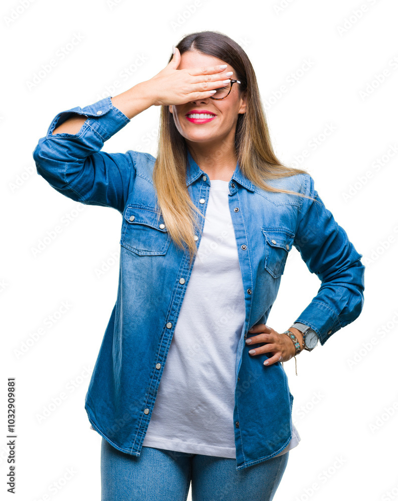 Wall mural Young beautiful woman over wearing glasses over isolated background smiling and laughing with hand on face covering eyes for surprise. Blind concept.