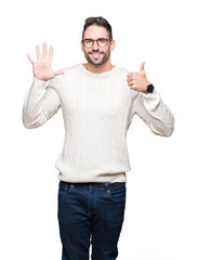 Naklejka premium Young handsome man wearing glasses over isolated background showing and pointing up with fingers number six while smiling confident and happy.