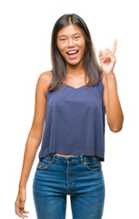 Young asian woman over isolated background pointing finger up with successful idea. Exited and happy. Number one.