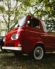 Vintage Red Pickup Truck with Classic Whitewall Tires at Car Show