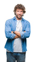 Fototapeta premium Handsome hispanic model man over isolated background happy face smiling with crossed arms looking at the camera. Positive person.