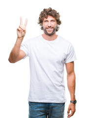 Naklejka premium Handsome hispanic model man over isolated background showing and pointing up with fingers number two while smiling confident and happy.
