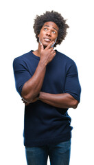 Afro american man over isolated background with hand on chin thinking about question, pensive expression. Smiling with thoughtful face. Doubt concept.