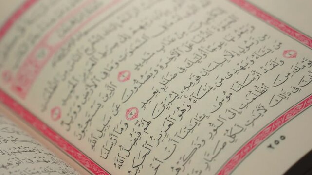 Quran (Koran) - close up of holy book of Muslims, with shining light.