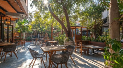 Obraz premium Cozy Outdoor Cafe with Lush Greenery and Sunlight