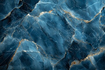 Textured blue marble surface with striking mineral patterns illuminated by soft light