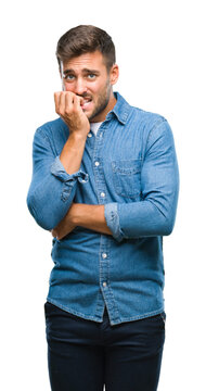 Young handsome man over isolated background looking stressed and nervous with hands on mouth biting nails. Anxiety problem.