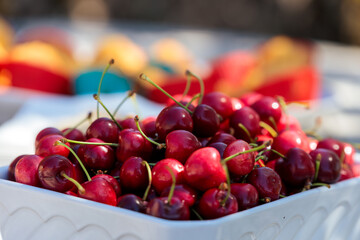 A White Bowl Full of Fresh Red Cherries