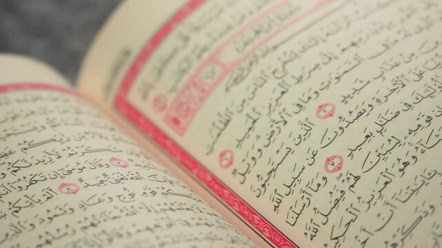 Quran (Koran) - close up of holy book of Muslims, with shining light.