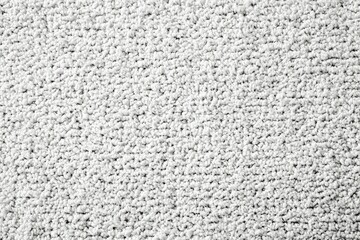 A white carpet with a lot of white fibers