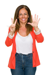 Beautiful middle age business adult woman over isolated background showing and pointing up with fingers number seven while smiling confident and happy.