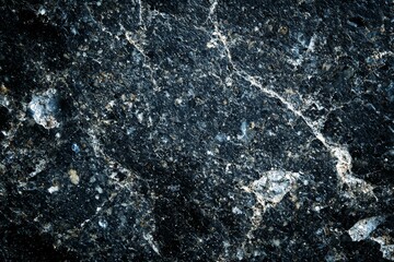 A black and white photo of a rock with a lot of texture
