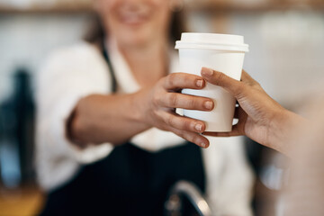 Coffee shop, customer and hands of waitress for drink, caffeine beverage and cappuccino in cafe. Small business, espresso and person with barista in restaurant, store or diner at breakfast service