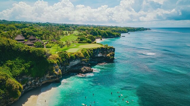 Aerial shot of beautiful golf course on overgrown rocky cliff top in sunny luxury tourist resort on paradise island