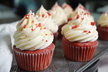 Red velvet cupcakes with rich vanilla buttercream frosting.