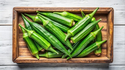 Vintage Style Photography of Organic Fresh Green Okra on Wooden Tray - Top View Isolated on White Background for Healthy Diet and Nutrition Focus