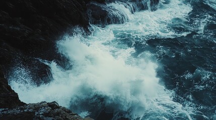 Fototapeta premium Dramatic waves crashing on rocky coastline