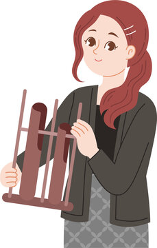 woman playing indonesia traditional musical instrument angklung
