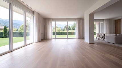 Fototapeta premium Modern open-concept living space with abundant natural light and scenic views of the outdoor landscape
