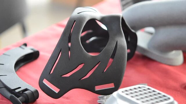 Various objects printed on a 3D printer from molten plastic powder. Different models printed on 3D printer from melted black polyamide powder. New additive 3D printing Multi Jet Fusion MJF technology